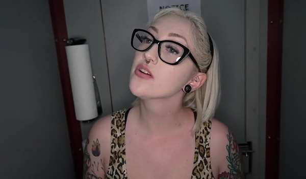 Tattooed blonde with a split tongue